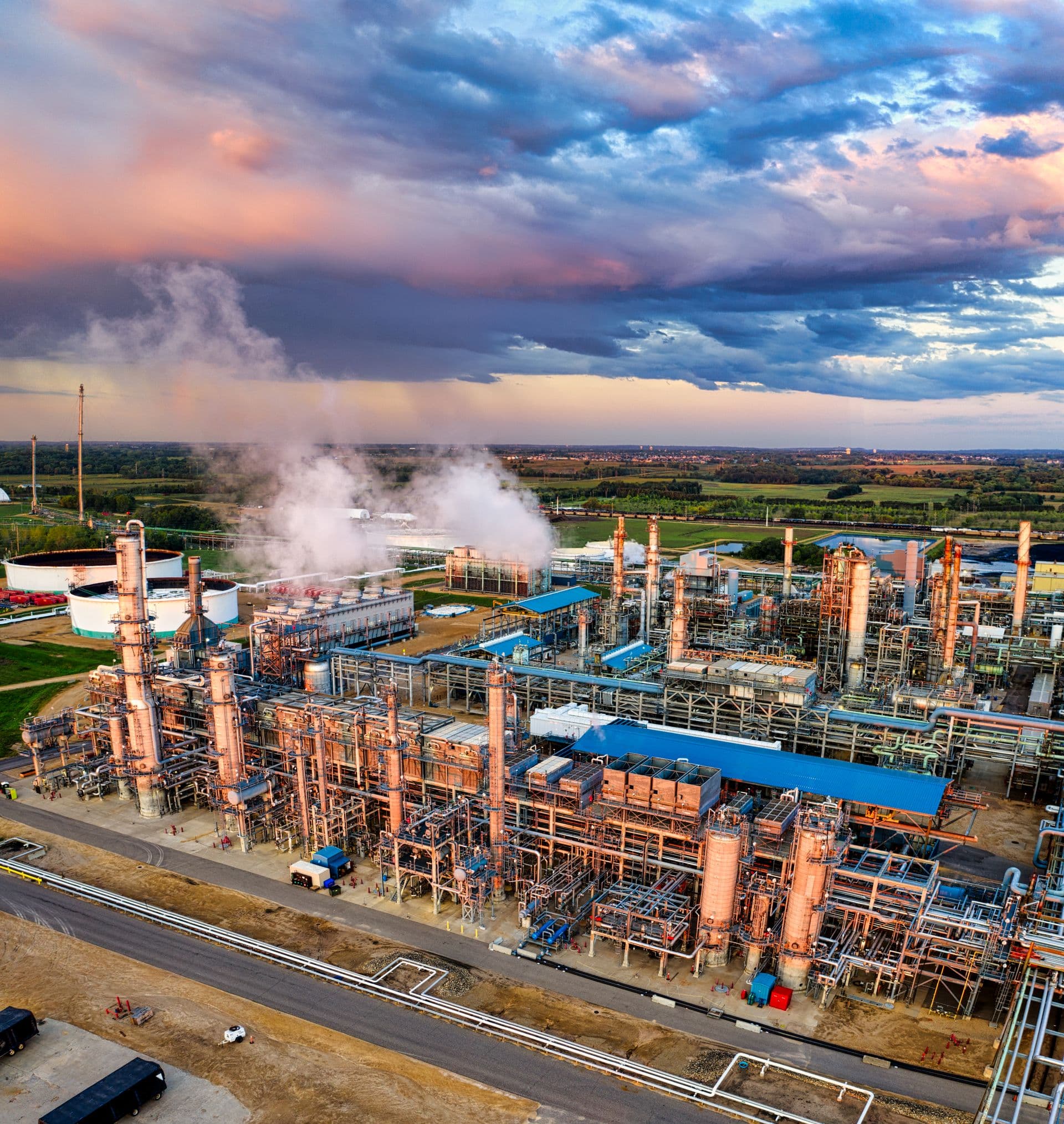 Oil refinery at sunset — oil and gas equipment sourcing